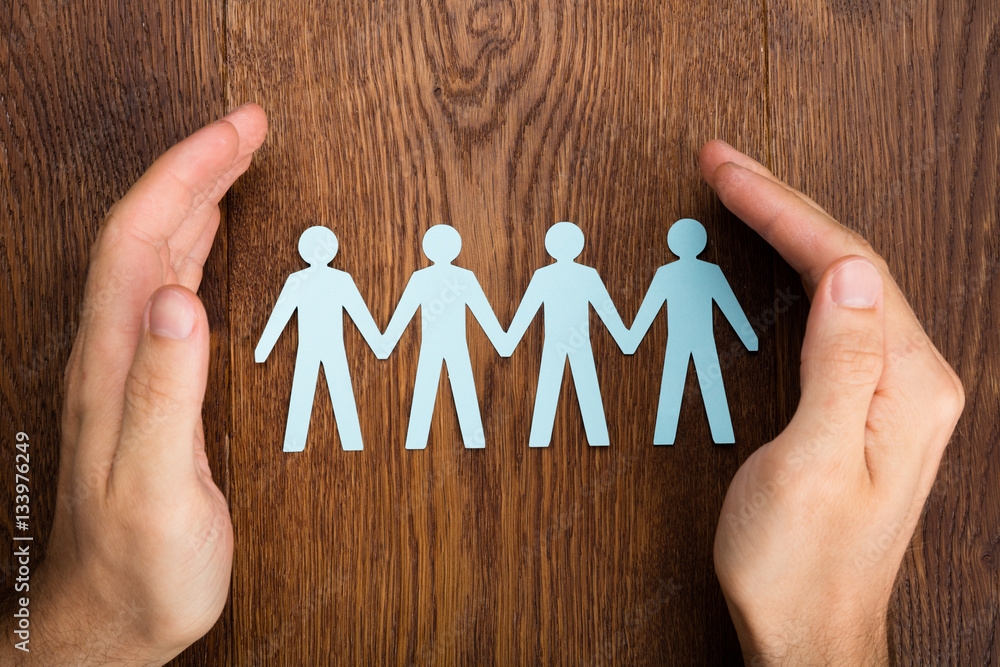 Person Hand Protecting Human Figure Cutout Person Hand Protecting Human Figure Cutout