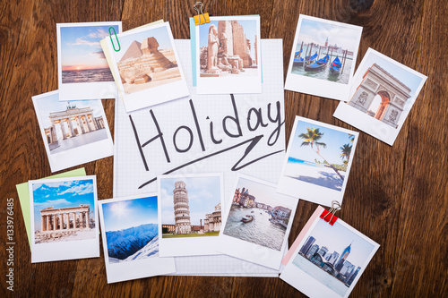 Obraz na plátně Holiday Photos On Wooden Desk