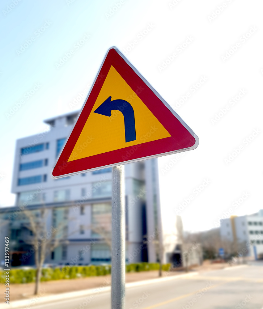 Signs warning of the curve