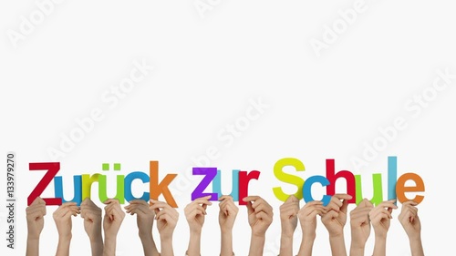 Hands holding up zuruck zur schule photo