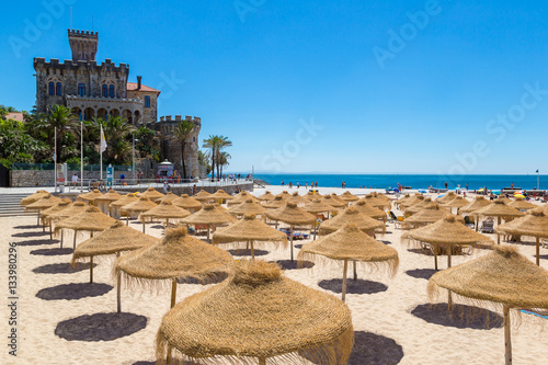 Umbrellas on public beach in Estoril