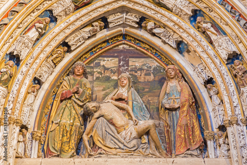 SEGOVIA, SPAIN, APRIL - 14, 2016: The relief of pieta on the portal in atrium of the Cathedral by Juan Guas (1483).