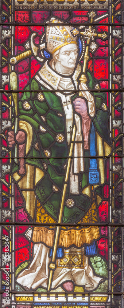ROME, ITALY - MARCH 9. 2016: The St. Thomas Becket (from Canterbury) on the stained glass of All Saints' Anglican Church by workroom Clayton and Hall (19. cent.)