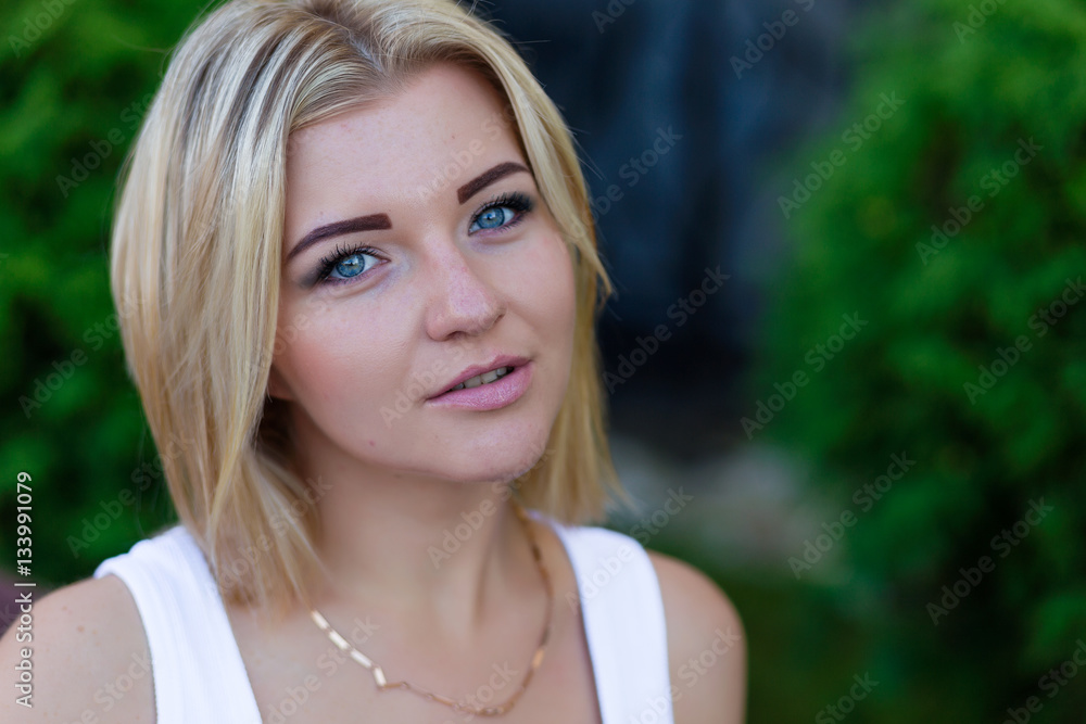 Portrait of a beautiful blonde outdoors in summer Portrait of a beautiful blonde outdoors in summer