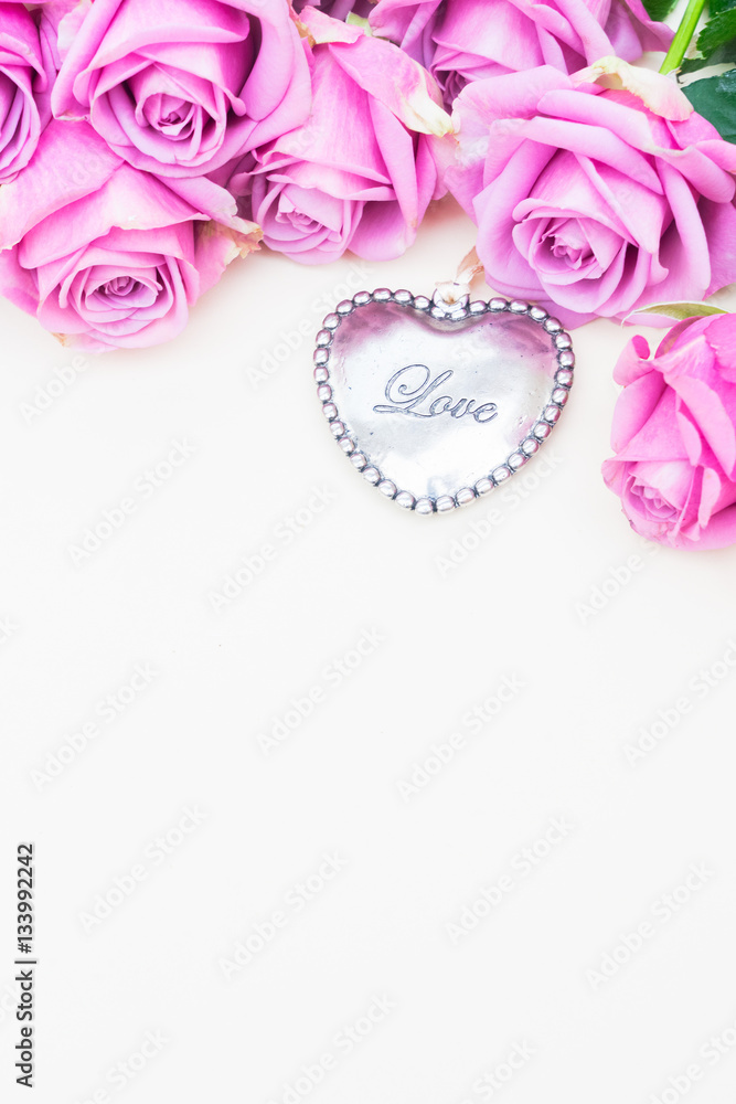 Valentines day violet roses top view flat lay scene with heart and copy space Valentines day violet roses top view flat lay scene with heart and copy space