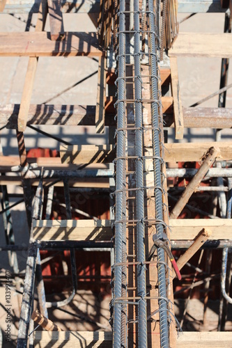 Construction worker ties reinforcing steel rebar. Close up