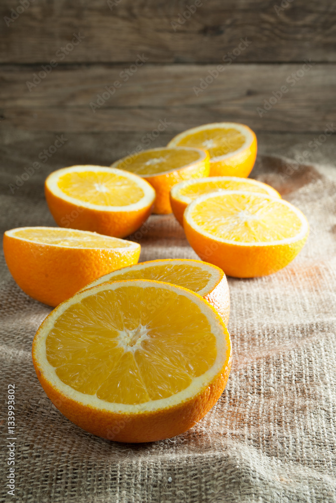 Oranges Fruits and Orange Slice on Wooden Table and Retro Fabric Oranges Fruits and Orange Slice on Wooden Table and Retro Fabric