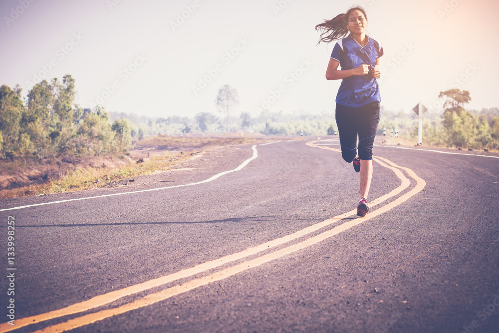 woman running along the road. outdoor jogging