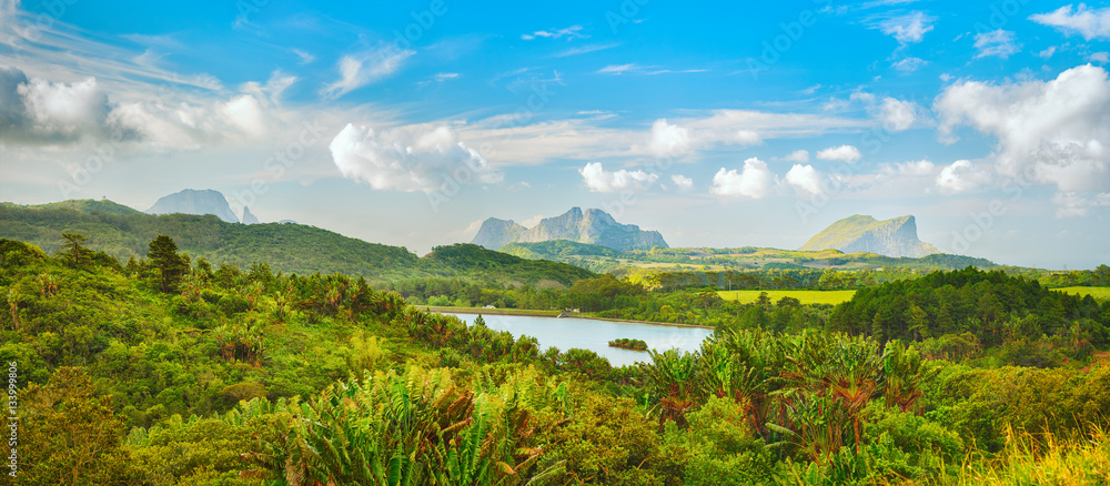 Fototapeta premium View of a lake and mountains. Mauritius. Panorama