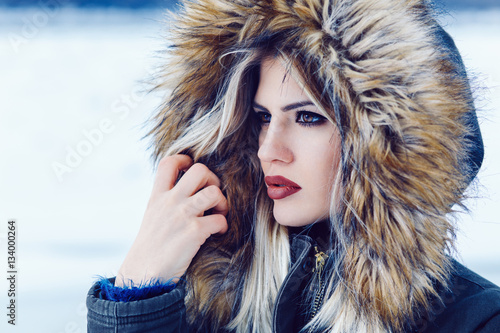 Portrait of a young beautiful woman on winter day