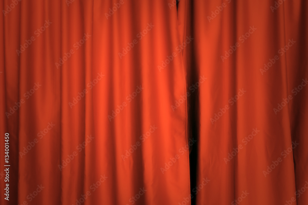 A red theater curtain. Background. Front view, pleasant shadows.
