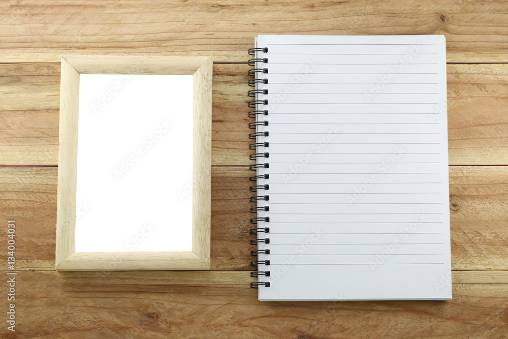Wooden frame and empty notebook. Wooden frame and empty notebook.