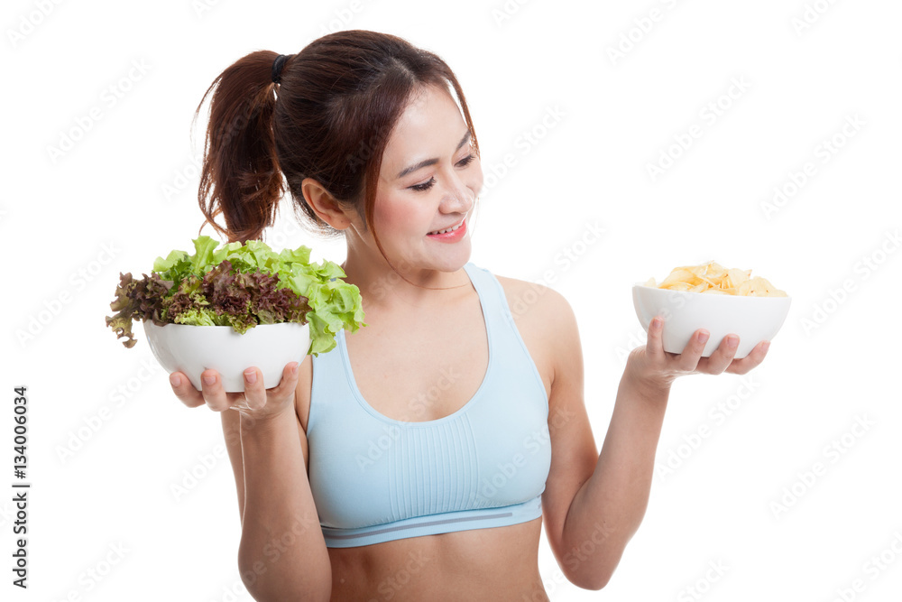 Beautiful Asian healthy girl salad and potato chips.
