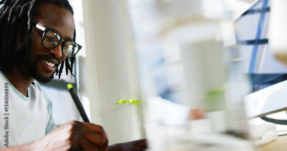 Graphic designer using graphics tablet Graphic designer using graphics tablet