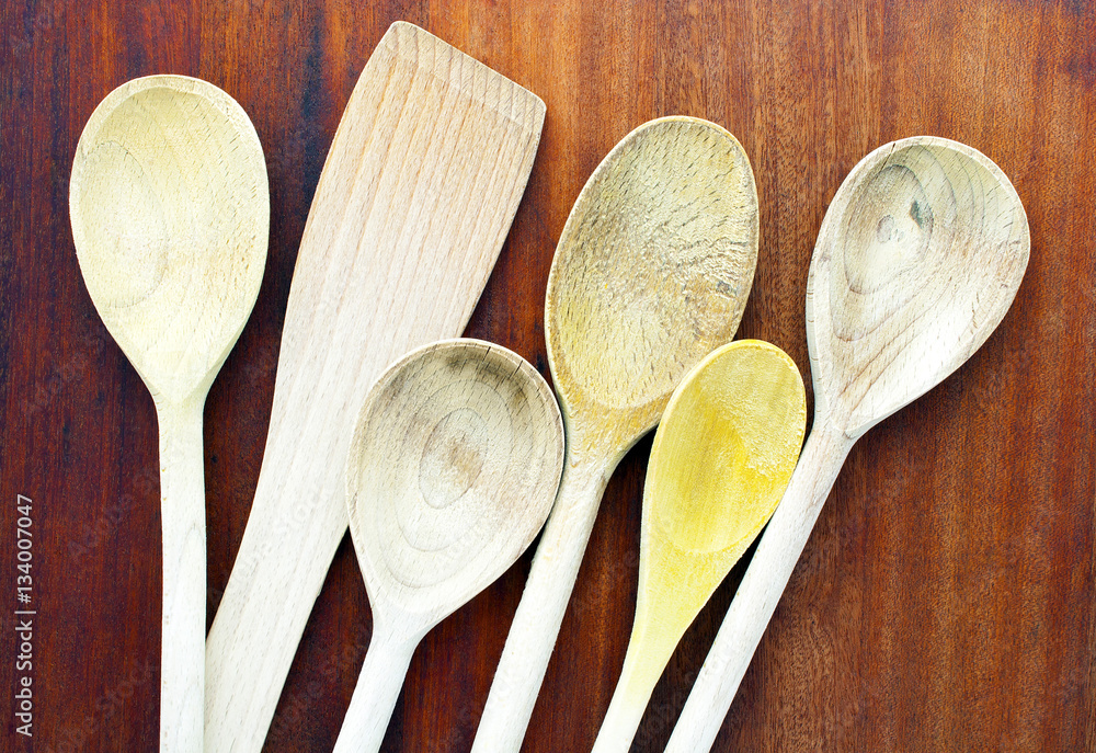 Wooden Kitchen Spoons on a Chopping Board Wooden Kitchen Spoons on a Chopping Board