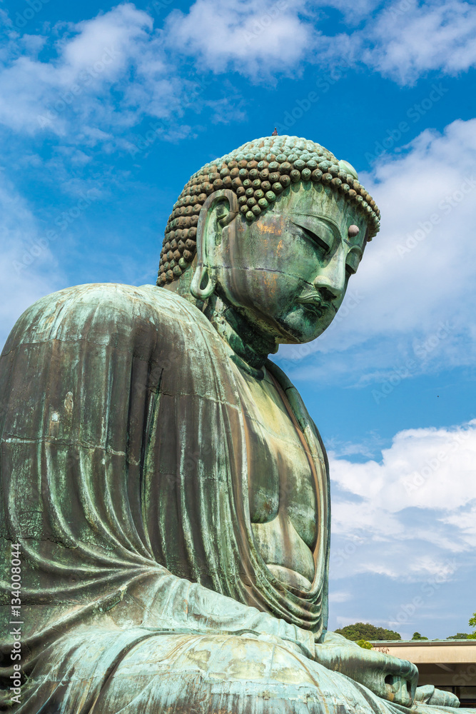 The Great Buddha in Kamakura Japan. Located in Kamakura, Kanagawa Prefecture Japan.There are pigeon to Buddha's head. The Great Buddha in Kamakura Japan. Located in Kamakura, Kanagawa Prefecture Japan.There are pigeon to Buddha's head.