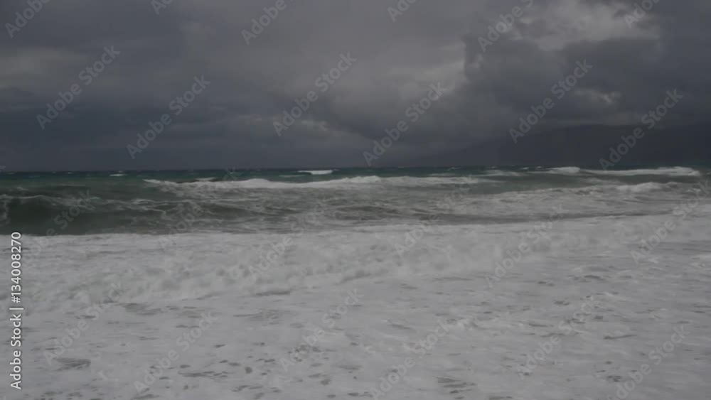 Rough sea and breakers at a coast in the mediterranean, Greece, island of Crete Rough sea and breakers at a coast in the mediterranean, Greece, island of Crete