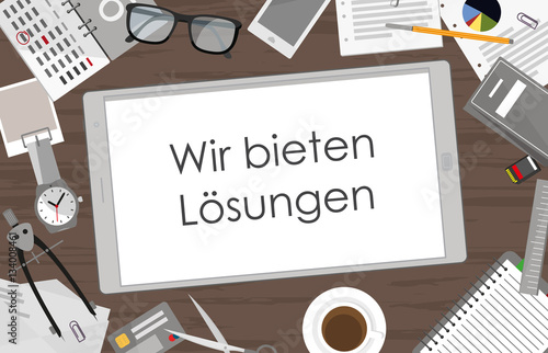 Wir bieten Lösungen - Tablet auf Schreibtisch