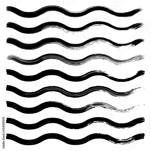 Set of black hand drawn wave lines on white background.