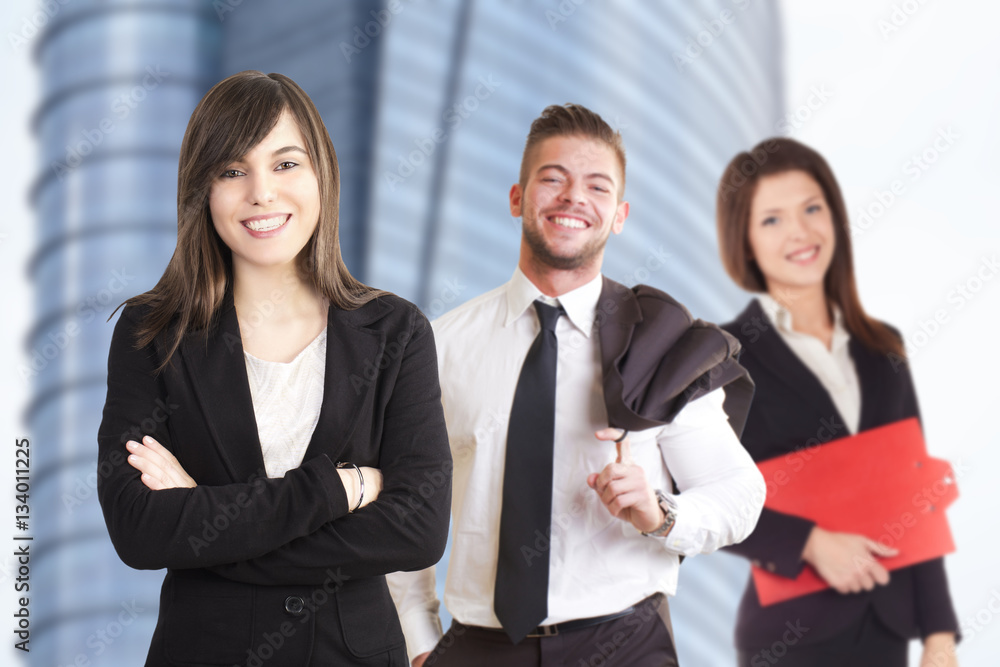 Group of business people stood outside building Group of business people stood outside building