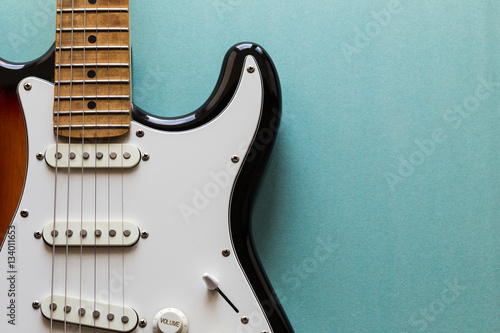 Electric guitar body and neck detail photo