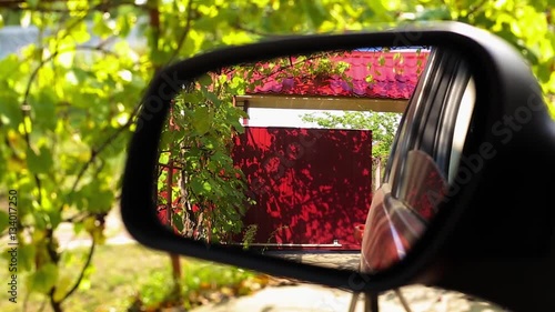 gates in the country are automatically opened, the gate can be seen in the rear view mirror of a car HD
