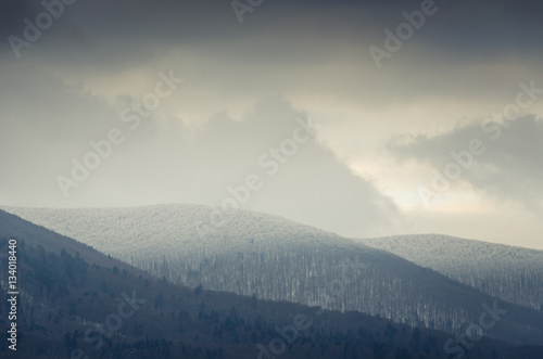 Fototapeta Naklejka Na Ścianę i Meble -  Winter landscape, snow-covered mountain tops with trees