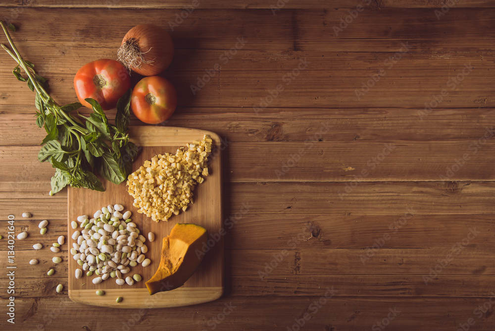 Assortment of fresh vegetables on a table. Horizontal indoors shot. Assortment of fresh vegetables on a table. Horizontal indoors shot.
