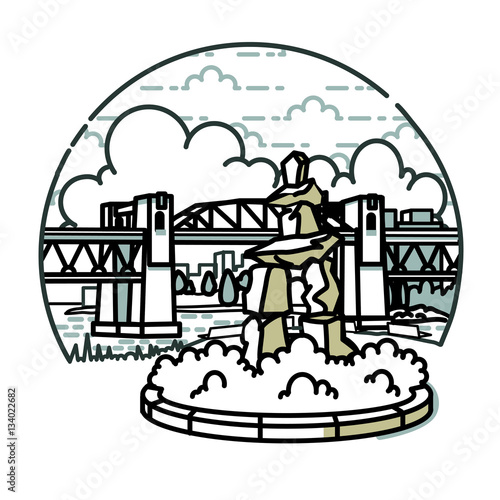 Bridge and Statue. A bridge with clouds in the background and an Inuksuk  statue in the foreground..
