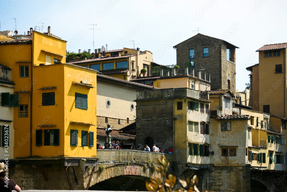 Tourists at the open span on the bridge Ponte Vecchio in Florence, Italy.