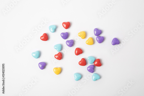 Miniature plastic hearts love on white background