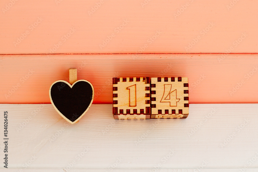 Wooden black heart on the white wooden table. Top view. Valentin Wooden black heart on the white wooden table. Top view. Valentin