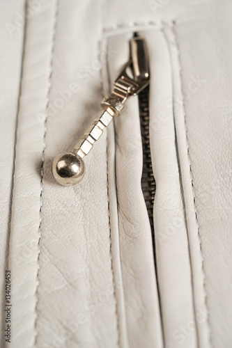 White leather jacket zipper. Macro leather jacket zipper and details
