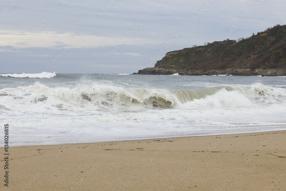 View of a big waves crashing at the shore.