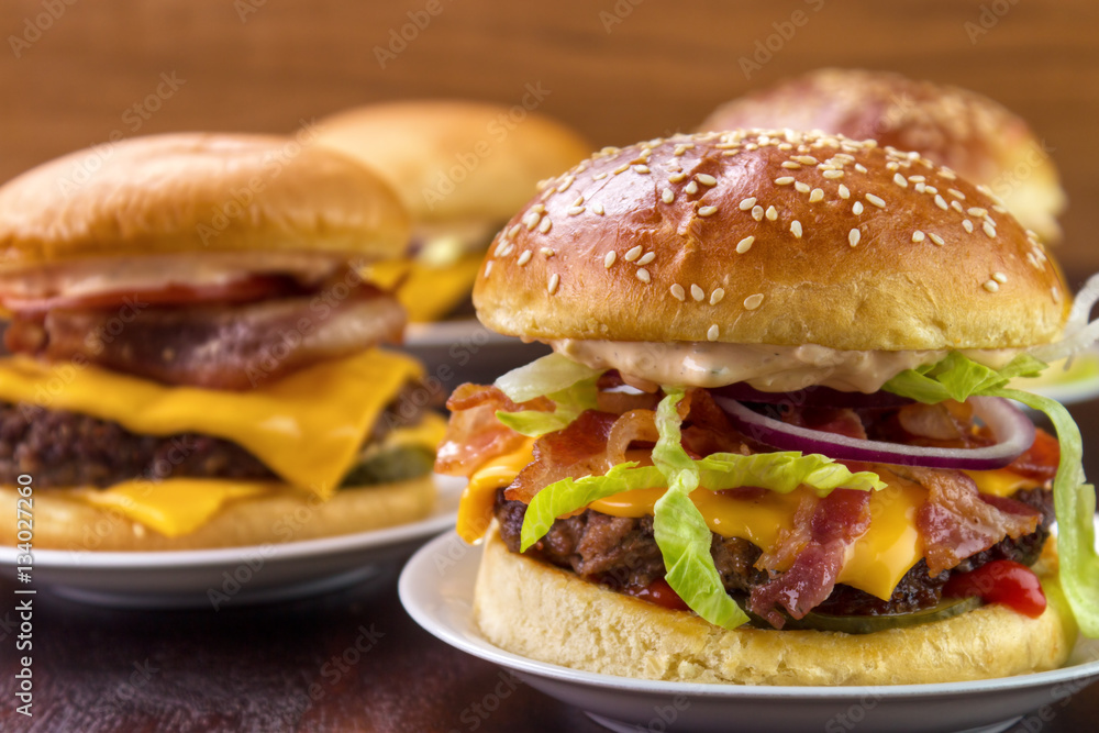 Group of different burgers on dish closeup