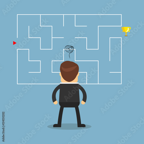 Businessman with a maze and think about solution to success.