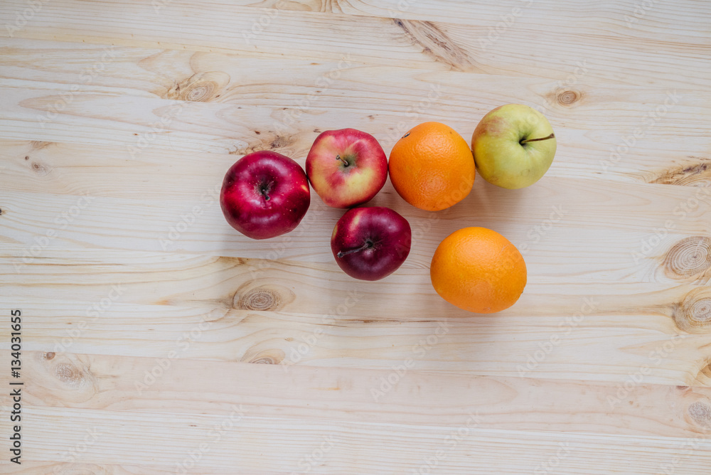 Fresh red and green apple, orange on wooden decks. Fresh red and green apple, orange on wooden decks.