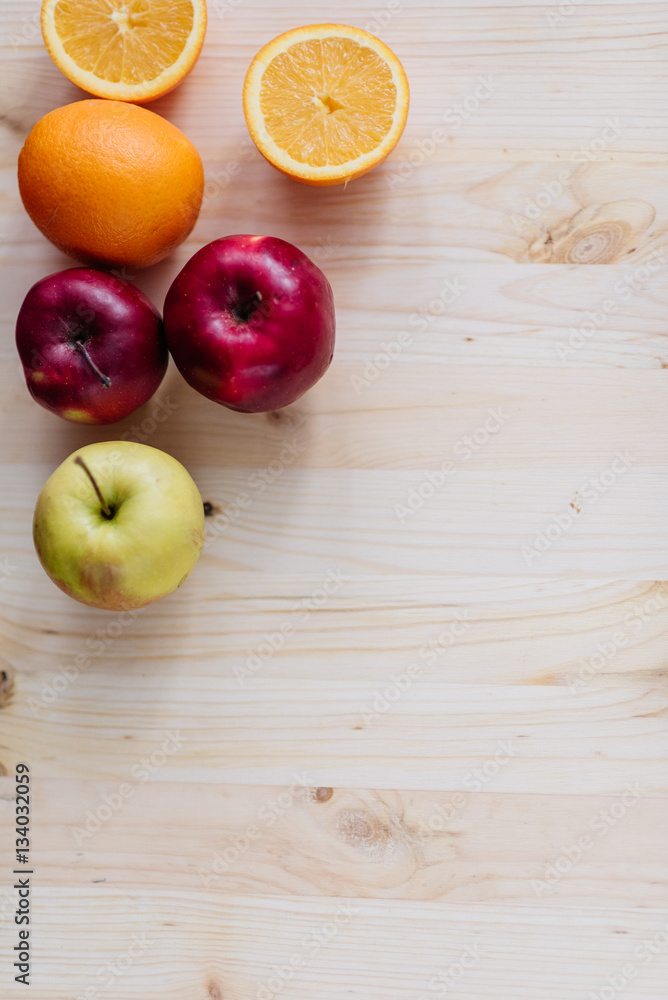 Fresh red and green apple, orange on wooden decks. Fresh red and green apple, orange on wooden decks.
