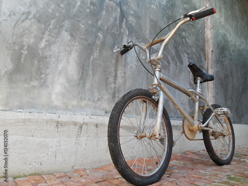 One Bike,Bicycle vintage style, Concrete wall,ฺBMX Bike.