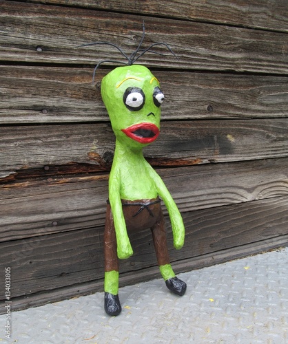 Bild auf Leinwand Paper mache zombie doll leaning against wall.
