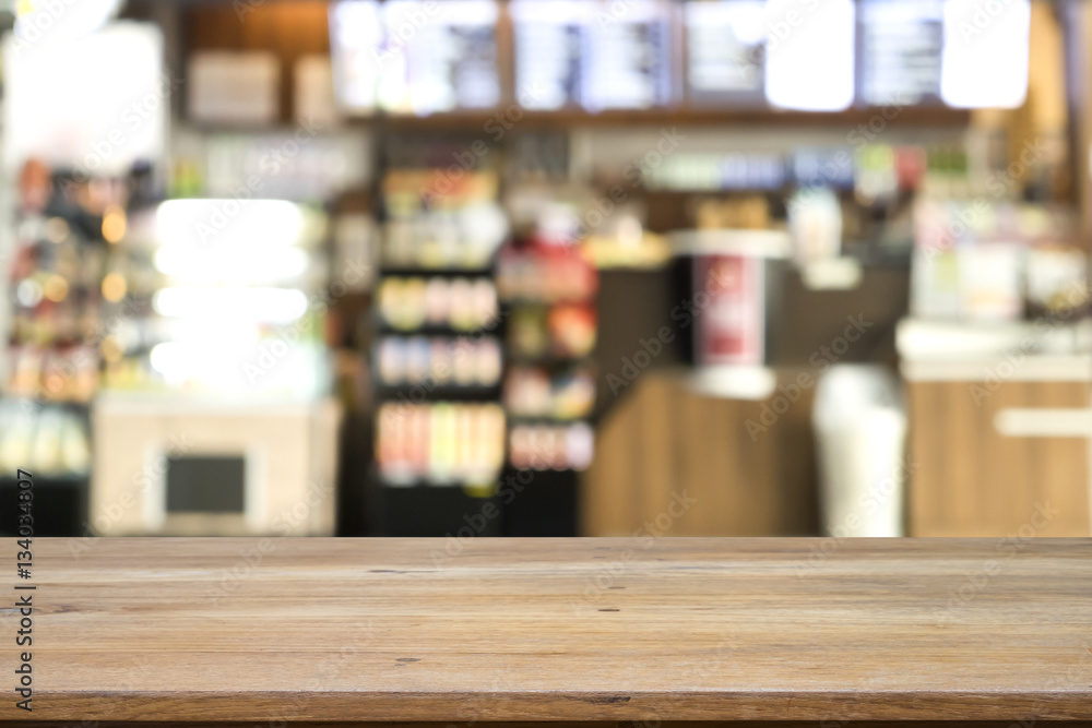 Empty wooden table space platform and blurred bakery shop or cof