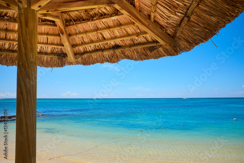 Fototapeta Naklejka Na Ścianę i Meble -  White sand beach with lounge chairs and umbrellas in Mauritius I