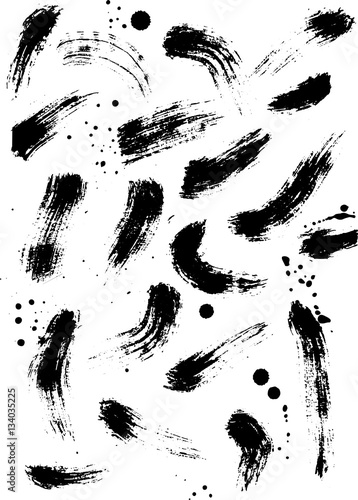 Set of dry brush strokes in black ink. Pattern of abstract watercolor spots with small splashes of paint. Effect of rapid brushing motion.