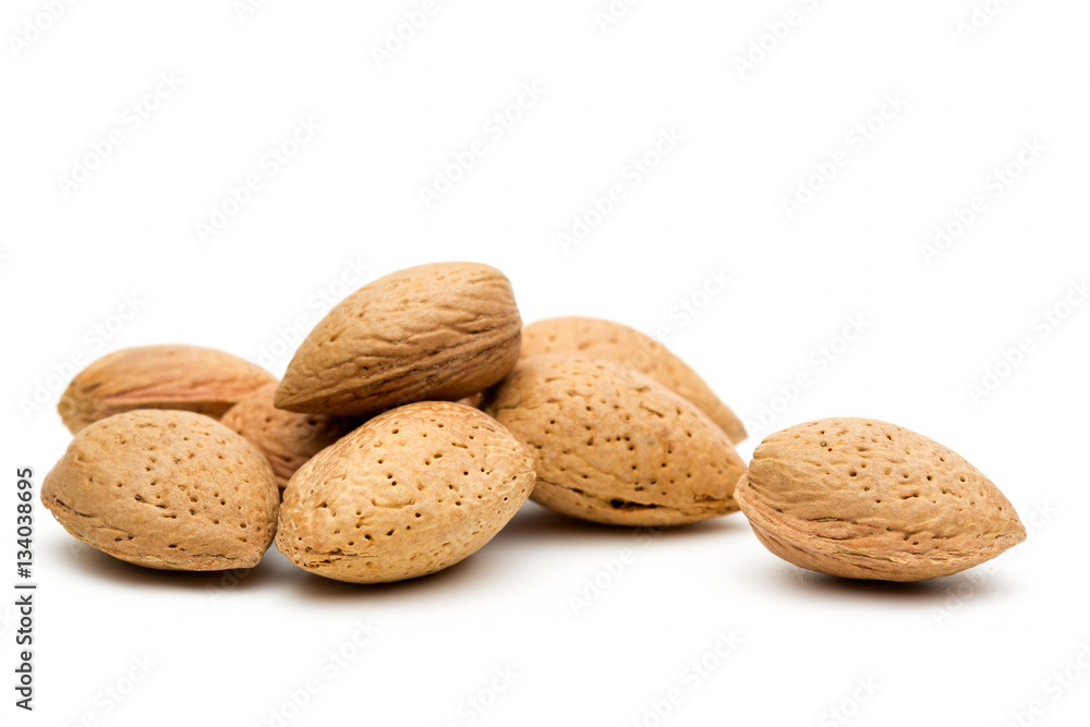 Pile of almonds in shells on a white background Pile of almonds in shells on a white background