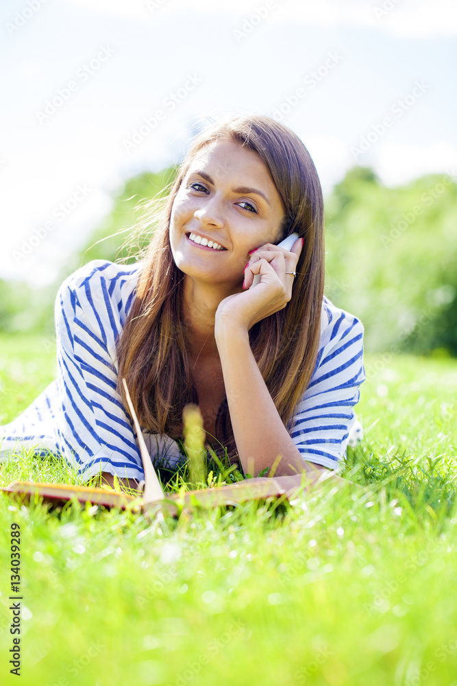 Young woman talking on a cell phone Young woman talking on a cell phone