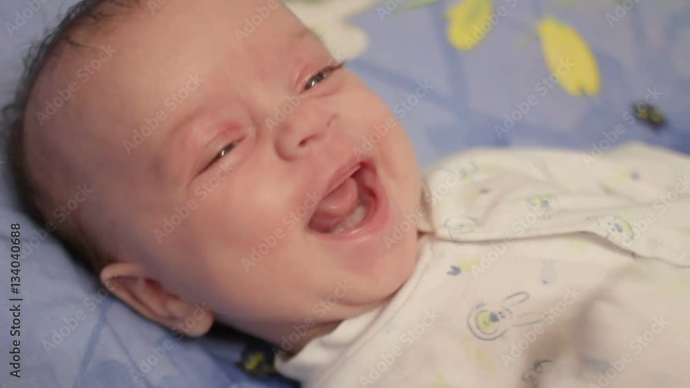 Small child with expressive eyes smiles sweetly Small child with expressive eyes smiles sweetly