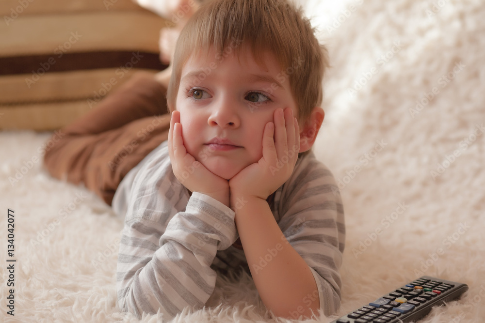little boy watching television at home little boy watching television at home