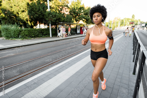 Young woman jogging on the street. Sport lifestyle. © Martinan