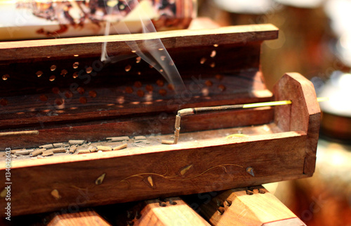 Incense stick on wooden box. Aromatherapy