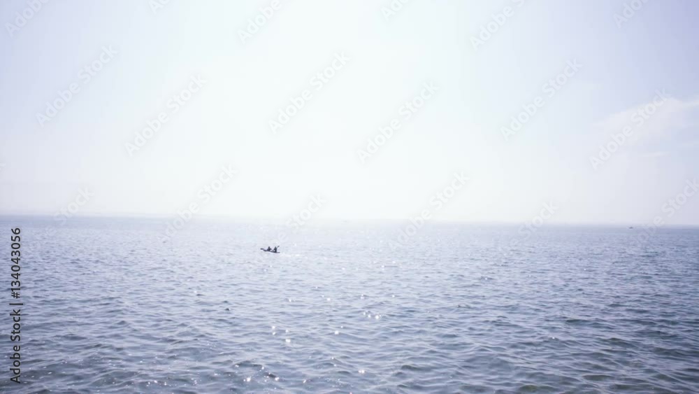 Two people kayaking at lake Bodensee on a sunny day Two people kayaking at lake Bodensee on a sunny day